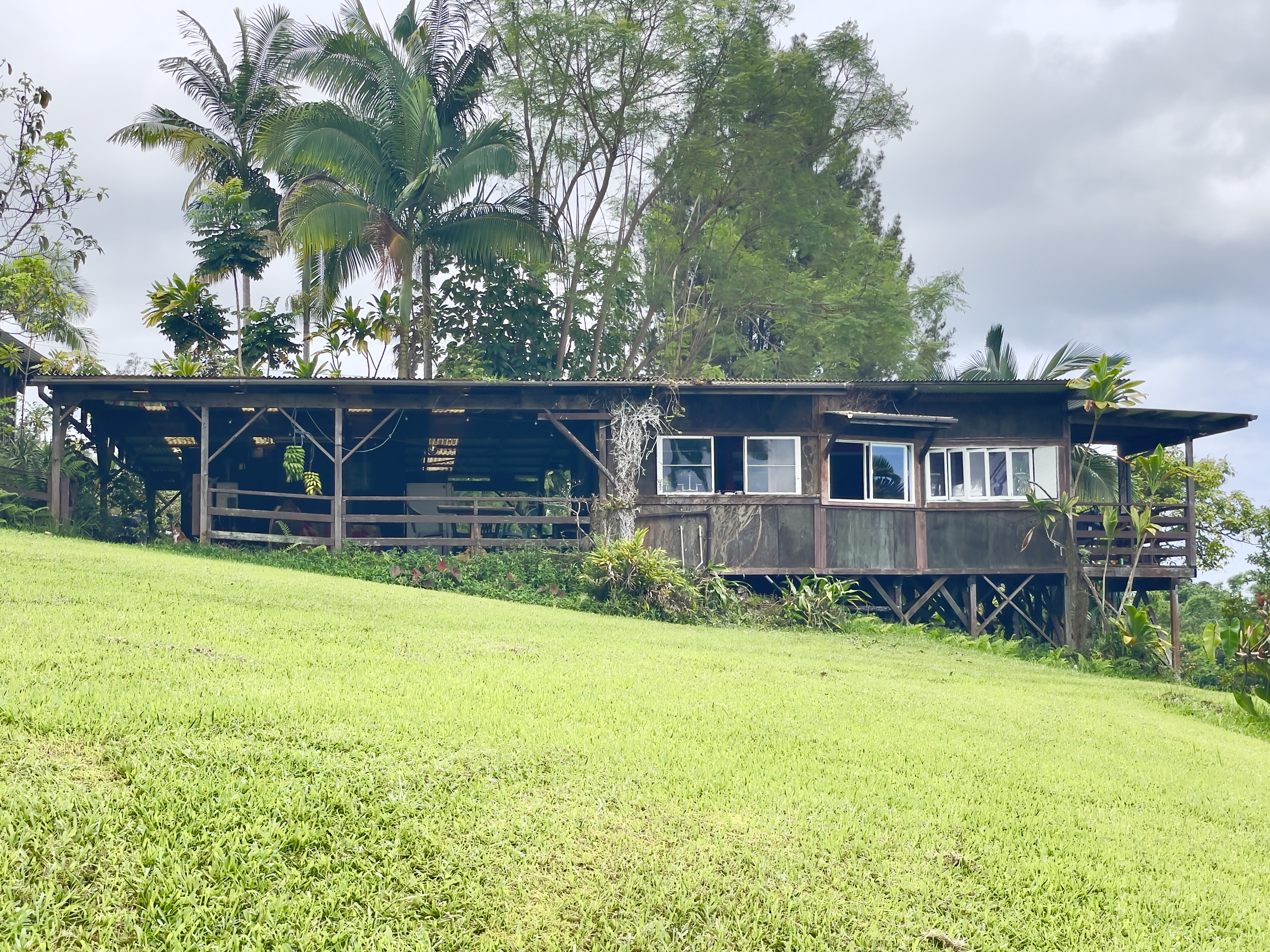 84-539 Telephone Exchange Road Captain Cook, HI 96704 - Photo 30 of 30 a view of a house with a yard and sitting area