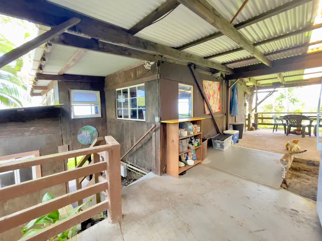 a view of a porch with furniture and a view of the porch