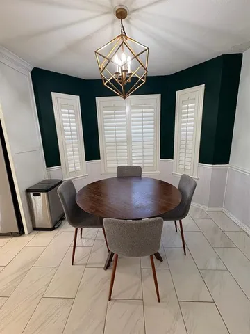 a view of a livingroom with furniture and window