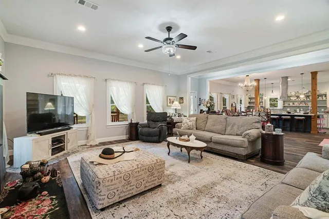 a living room with furniture and a flat screen tv