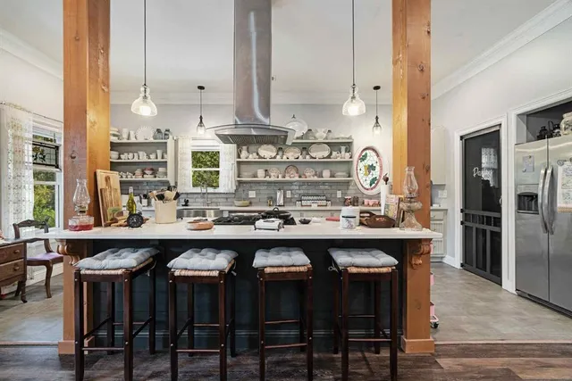 a kitchen with appliances and wooden cabinets