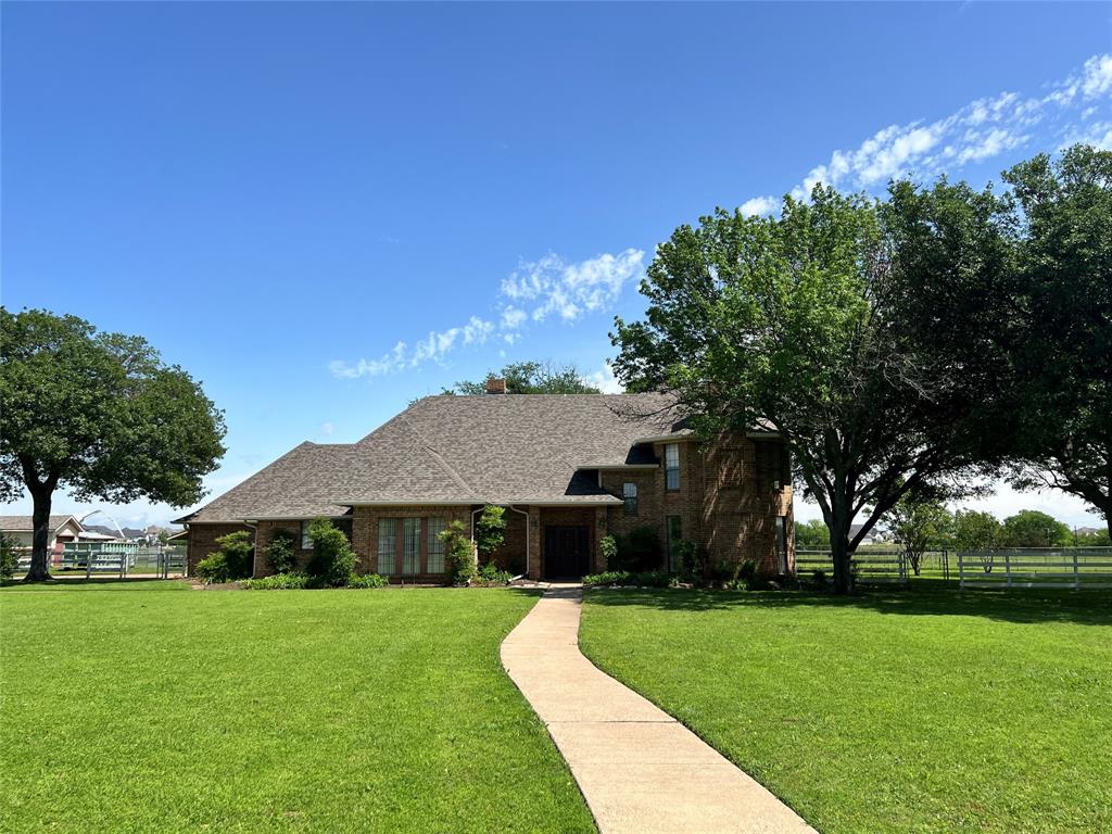 4902 Hackberry Lane Parker, TX 75002 - Photo 1 of 1 a front view of a house with garden