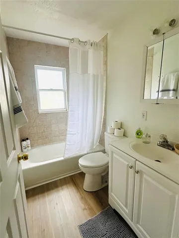 a bathroom with a sink a toilet and a bathtub