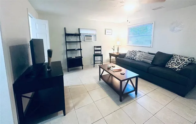 a living room with furniture and a couch