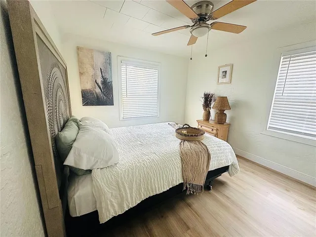 a bedroom with bed and window