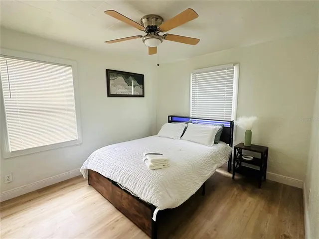 a bedroom with a bed and a table