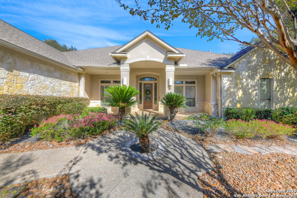 a front view of a house with garden