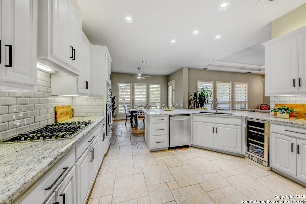 142 Candelaria Helotes, TX 78023 - Photo 13 of 53 a kitchen with white cabinets and appliances