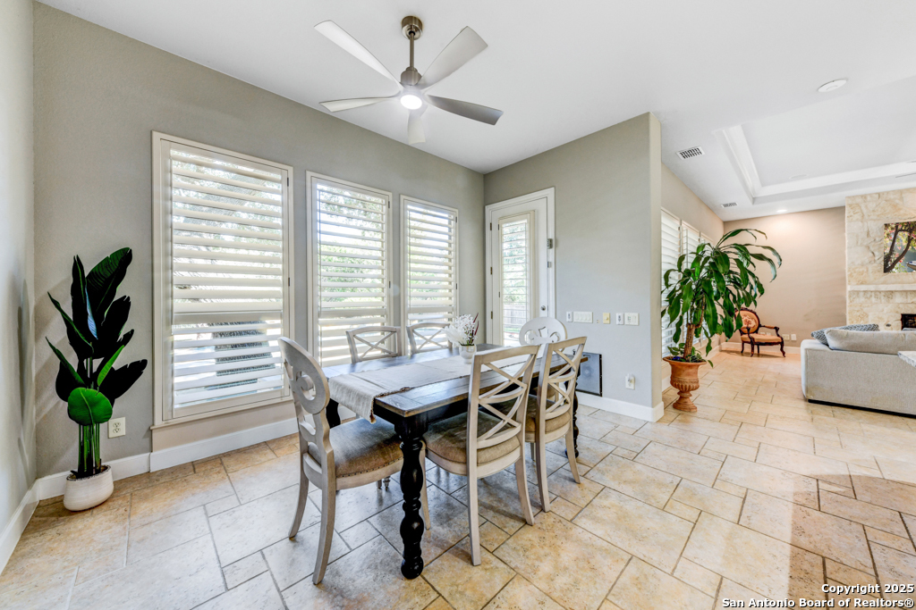 142 Candelaria Helotes, TX 78023 - Photo 14 of 53 a view of a dining room with furniture window and wooden floor