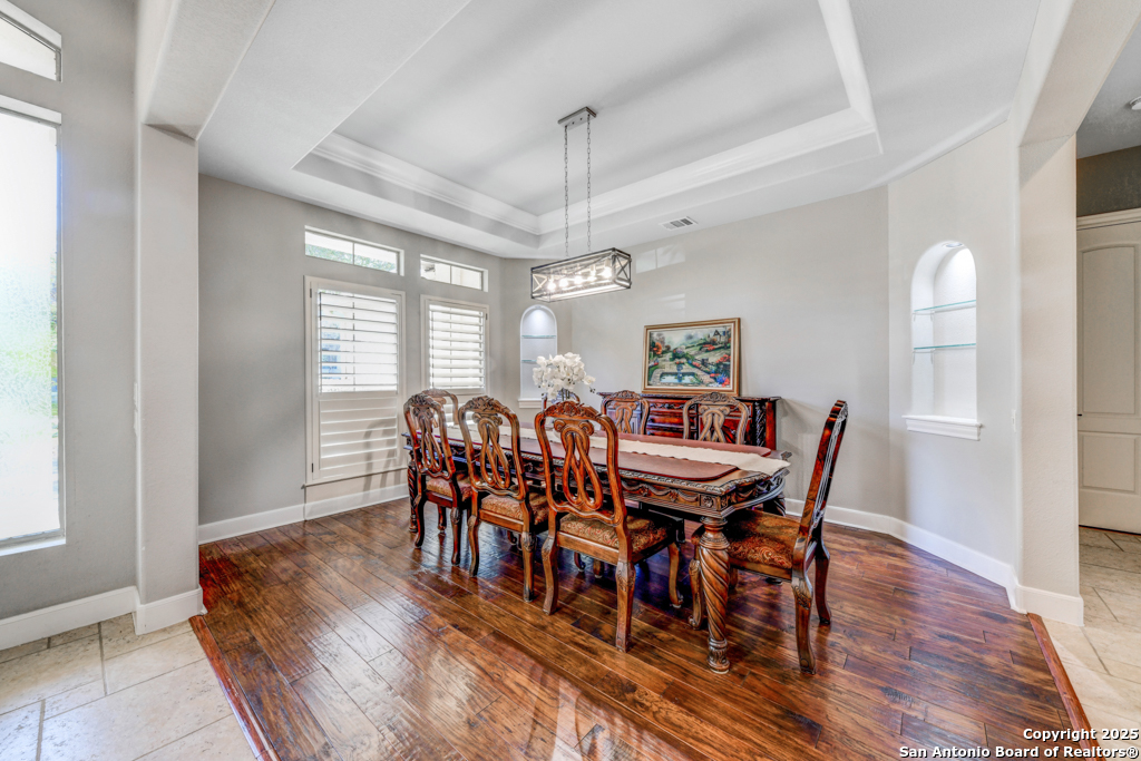 142 Candelaria Helotes, TX 78023 - Photo 16 of 53 a view of a dining room with furniture window and wooden floor