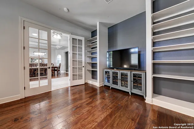 a bathroom with a granite countertop sink and a mirror with toilet