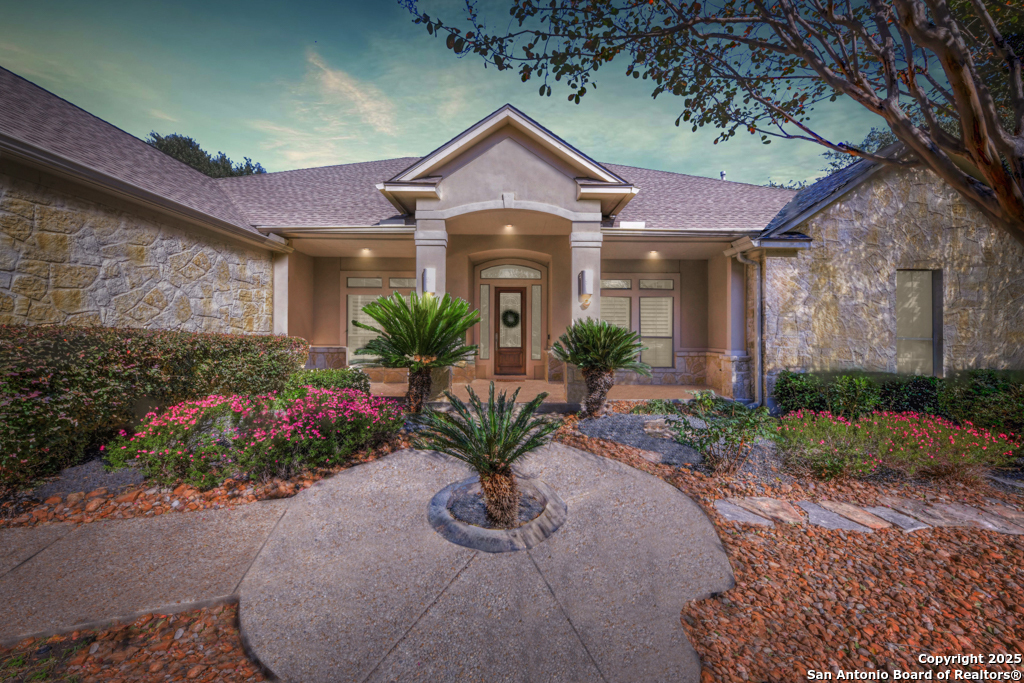 142 Candelaria Helotes, TX 78023 - Photo 2 of 53 a front view of a house with a yard
