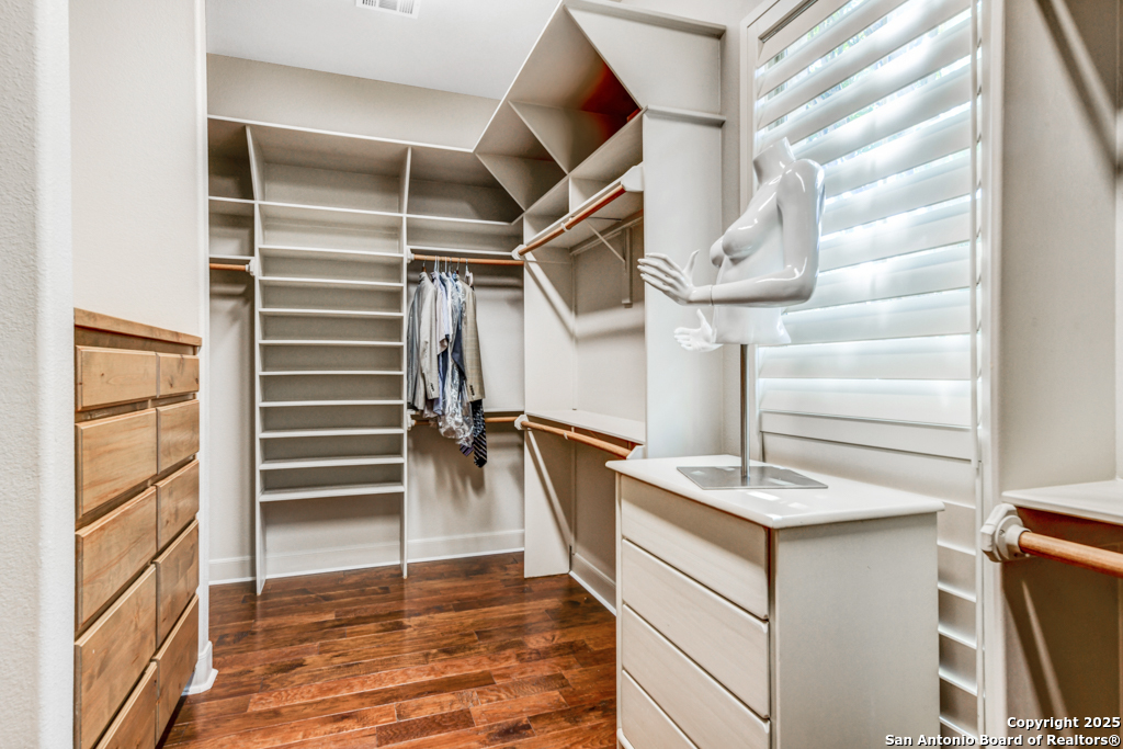142 Candelaria Helotes, TX 78023 - Photo 25 of 53 a view of walk in closet with empty racks