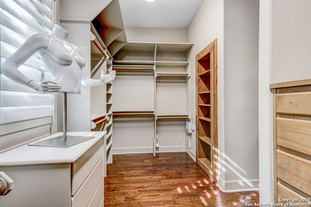 142 Candelaria Helotes, TX 78023 - Photo 26 of 53 a view of walk in closet with empty racks