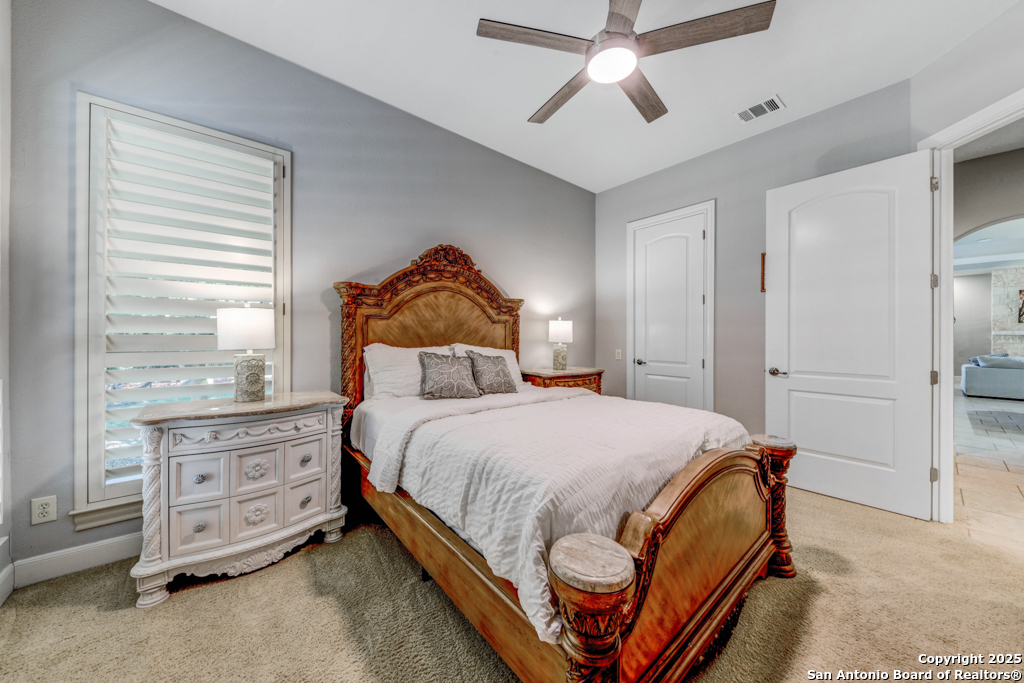 142 Candelaria Helotes, TX 78023 - Photo 30 of 53 a bedroom with a bed and window