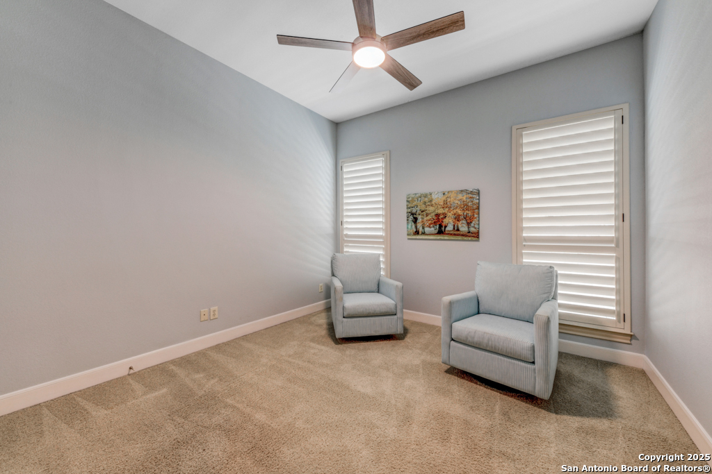 142 Candelaria Helotes, TX 78023 - Photo 32 of 53 a hallway with a couch and a window
