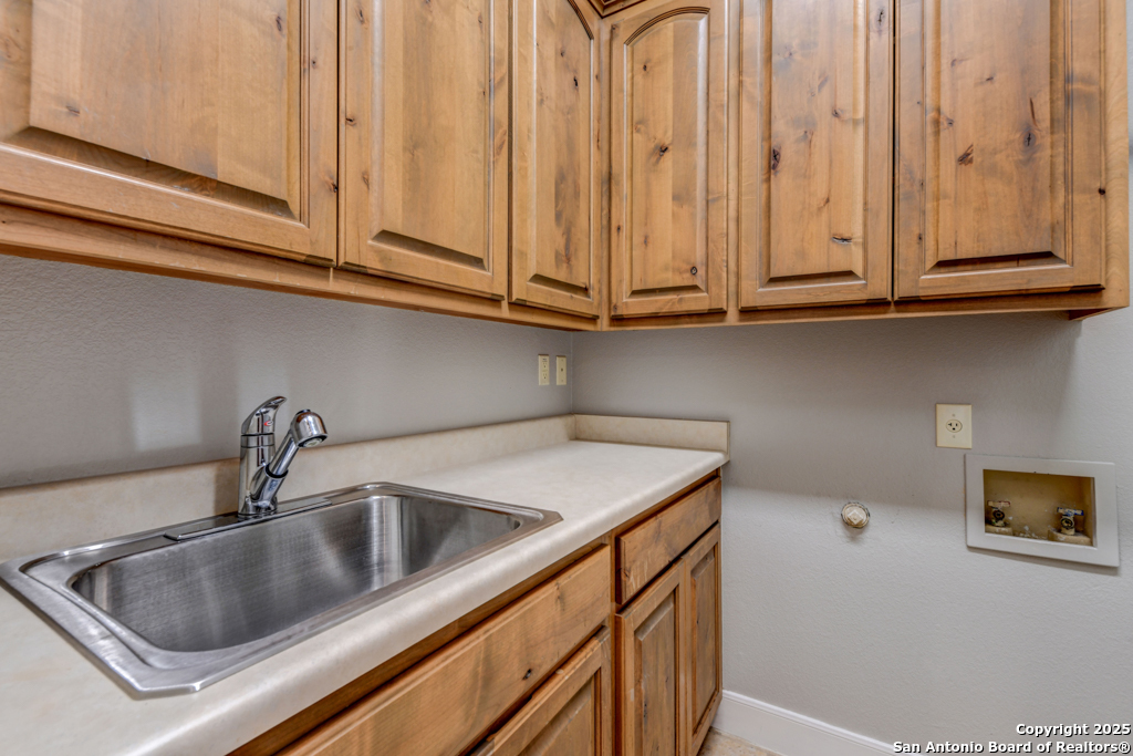142 Candelaria Helotes, TX 78023 - Photo 34 of 53 a close view of sink and tap