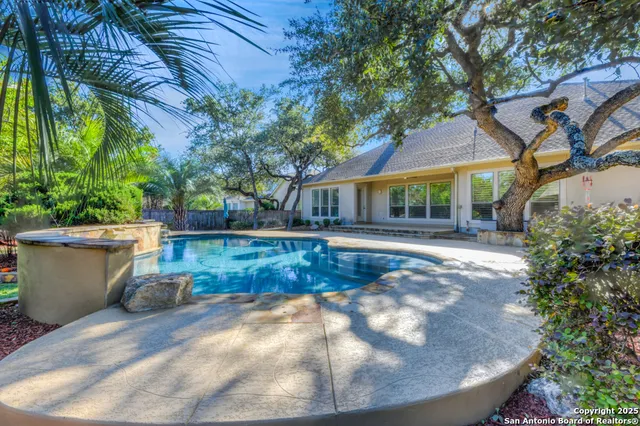 a view of a tree in front of a house