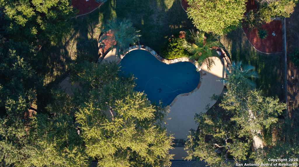 142 Candelaria Helotes, TX 78023 - Photo 51 of 53 an aerial view of a house with a yard and garden