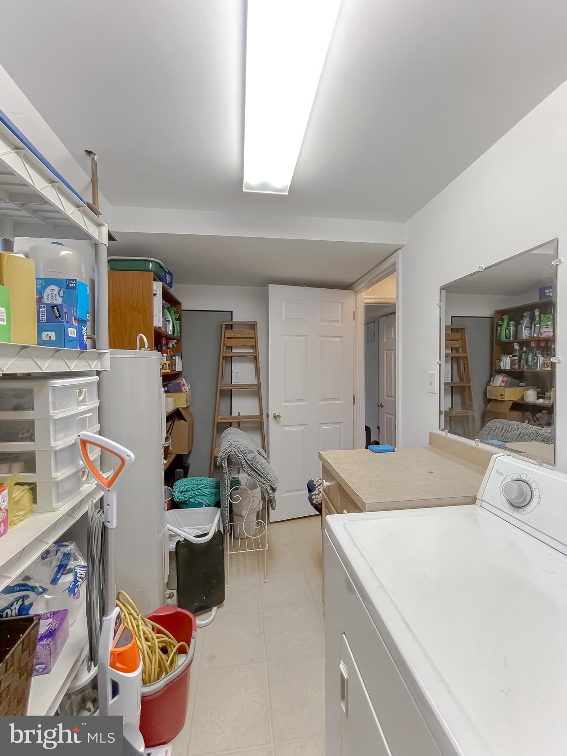 6015 Fir Road St. Leonard, MD 20685 - Photo 38 of 57 Laundry room with plenty of storage