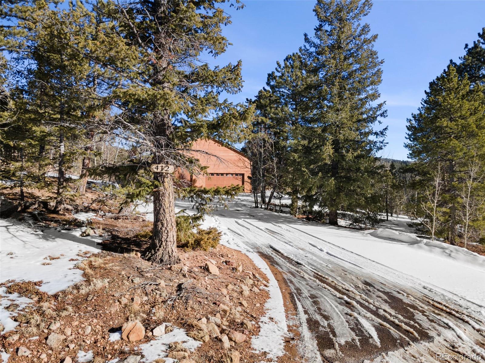 412 Evergreen Road Black Hawk, CO 80422 - Photo 3 of 48 a view of city street with a tree