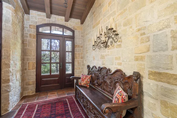 a view of a balcony with wooden floor