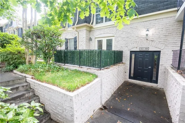 a view of a house with a tub and small yard