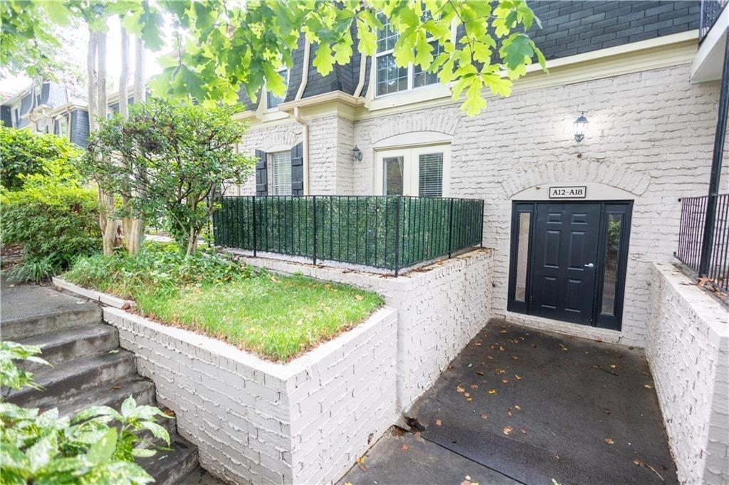 a view of a house with a tub and small yard