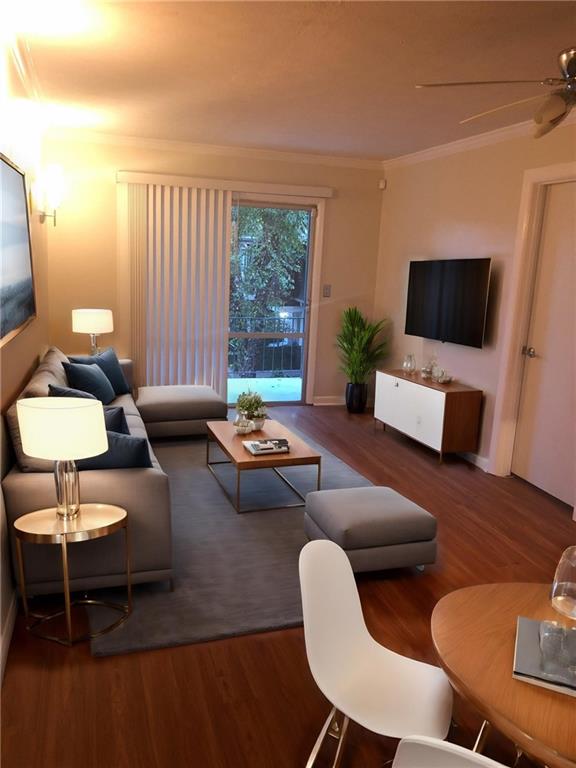 2805 Northeast Expressway, Unit A14 Atlanta, GA 30345 - Photo 3 of 13 a living room with furniture and a flat screen tv