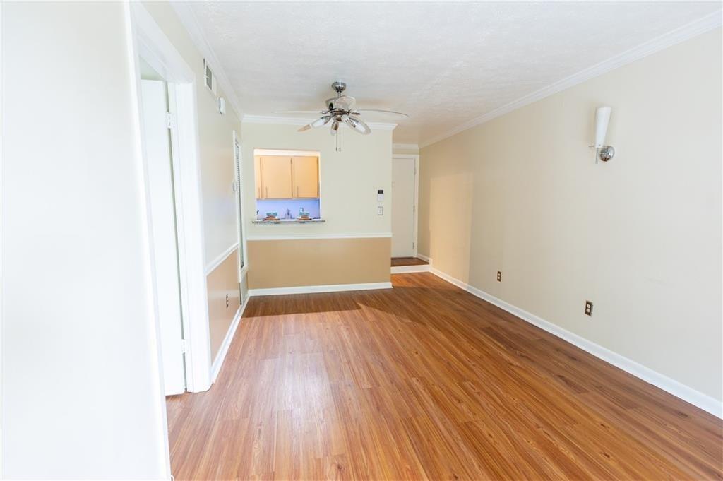 2805 Northeast Expressway, Unit A14 Atlanta, GA 30345 - Photo 5 of 13 a view of empty room with wooden floor and fan