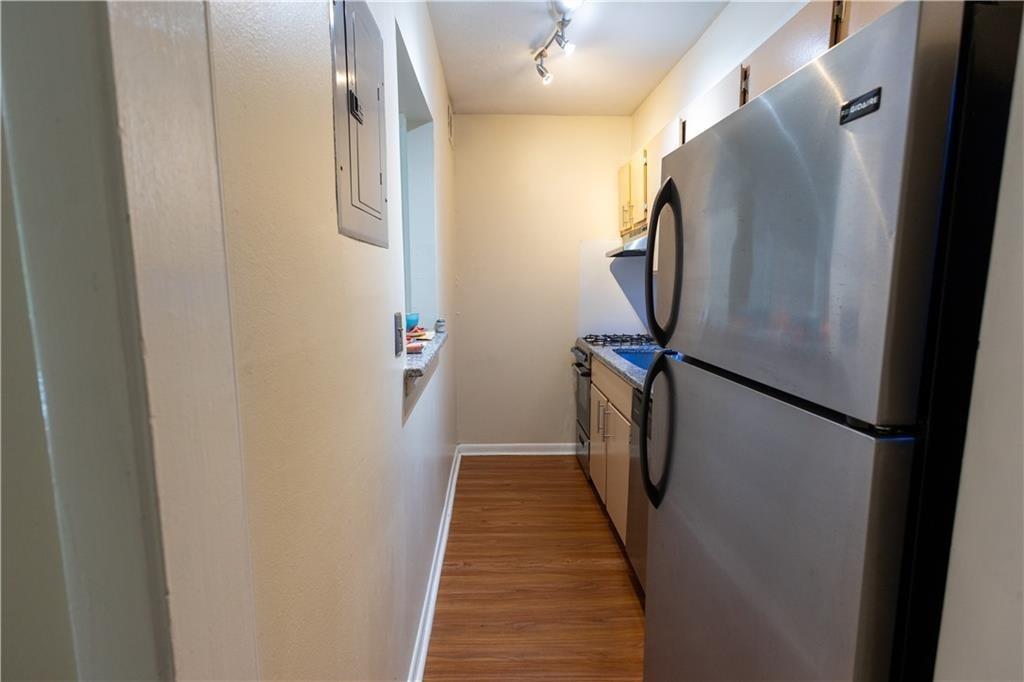 2805 Northeast Expressway, Unit A14 Atlanta, GA 30345 - Photo 8 of 13 a view of a hallway with wooden floor
