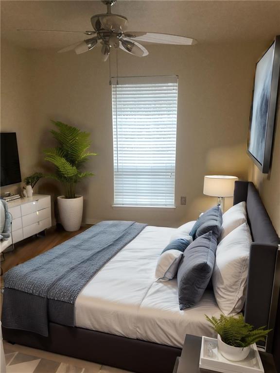 2805 Northeast Expressway, Unit A14 Atlanta, GA 30345 - Photo 10 of 13 a bedroom with a bed and wooden floor