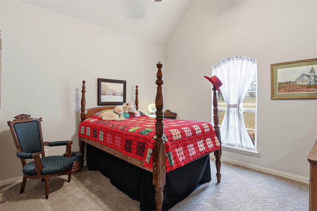 140 Flying Diamond Drive Springtown, TX 76082 - Photo 17 of 30 a bed room with a bed and a chair
