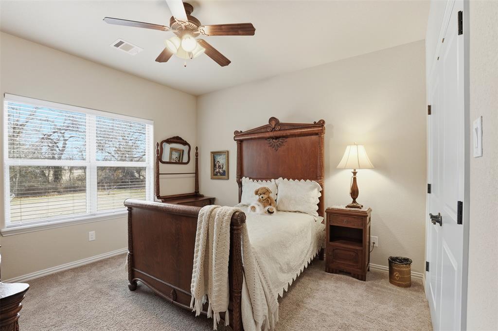 140 Flying Diamond Drive Springtown, TX 76082 - Photo 20 of 30 a bedroom with a bed and a window