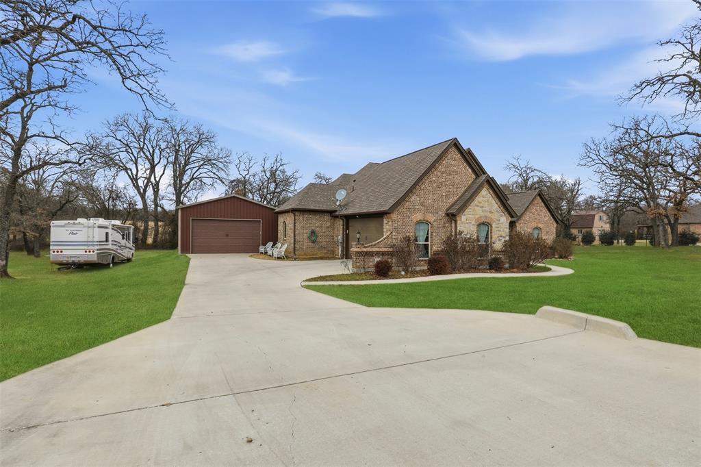 140 Flying Diamond Drive Springtown, TX 76082 - Photo 2 of 30 a front view of house with yard and green space