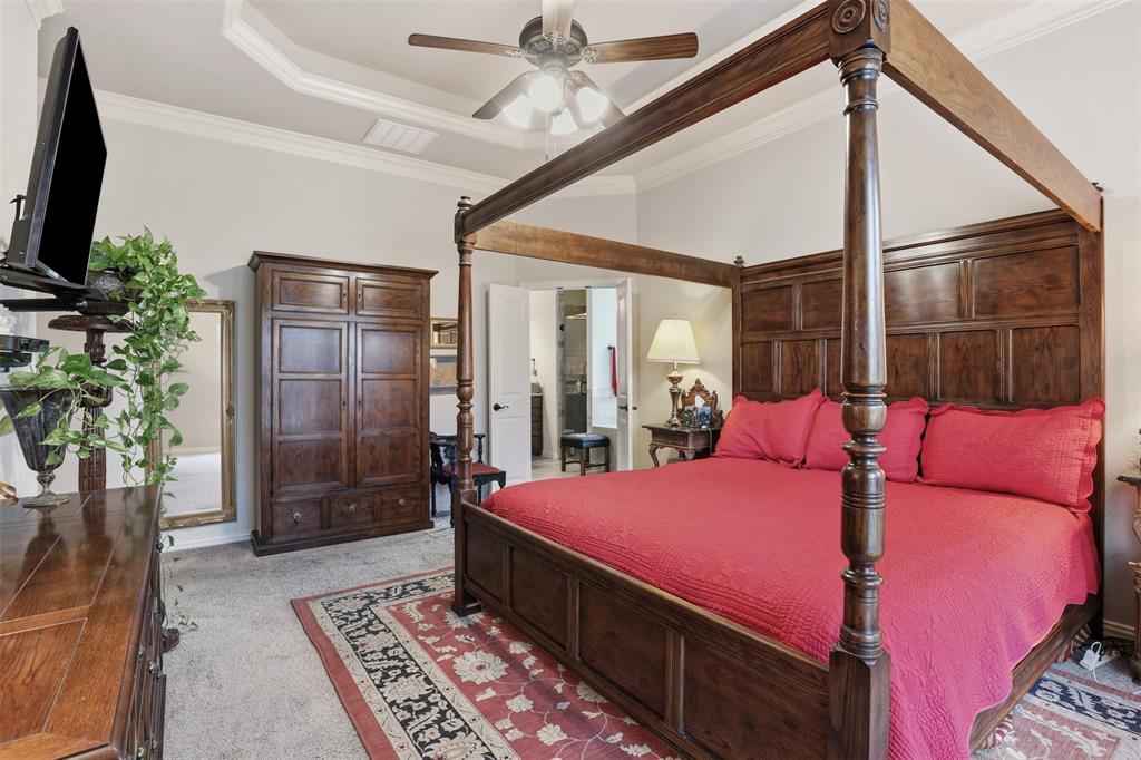 140 Flying Diamond Drive Springtown, TX 76082 - Photo 22 of 30 a bedroom with a bed and a potted plant