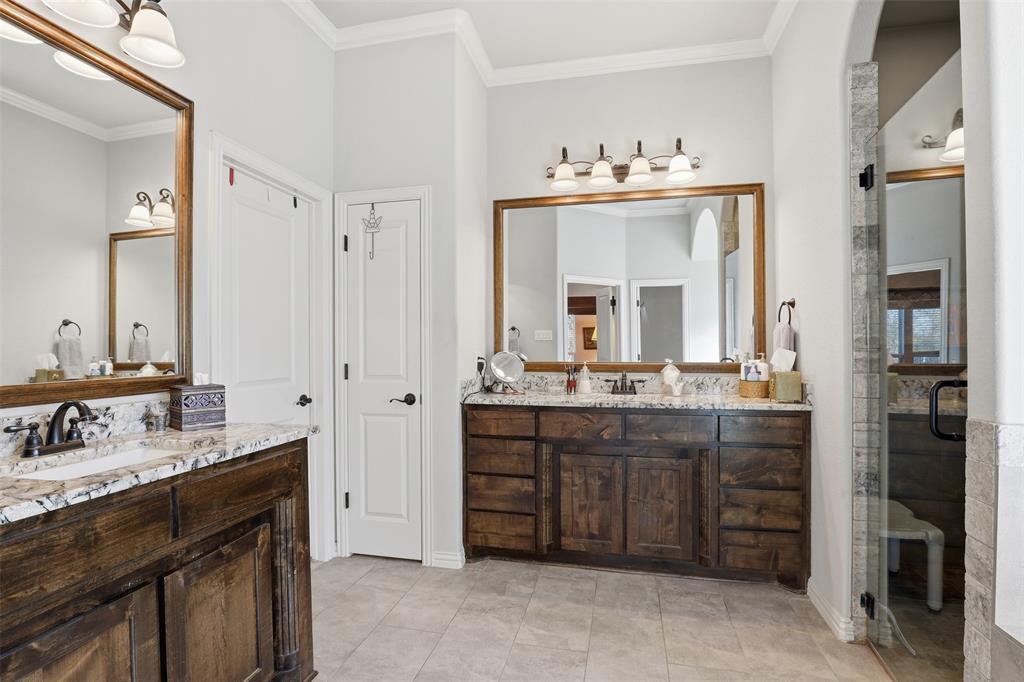 140 Flying Diamond Drive Springtown, TX 76082 - Photo 23 of 30 a bathroom with a sink vanity and a mirror