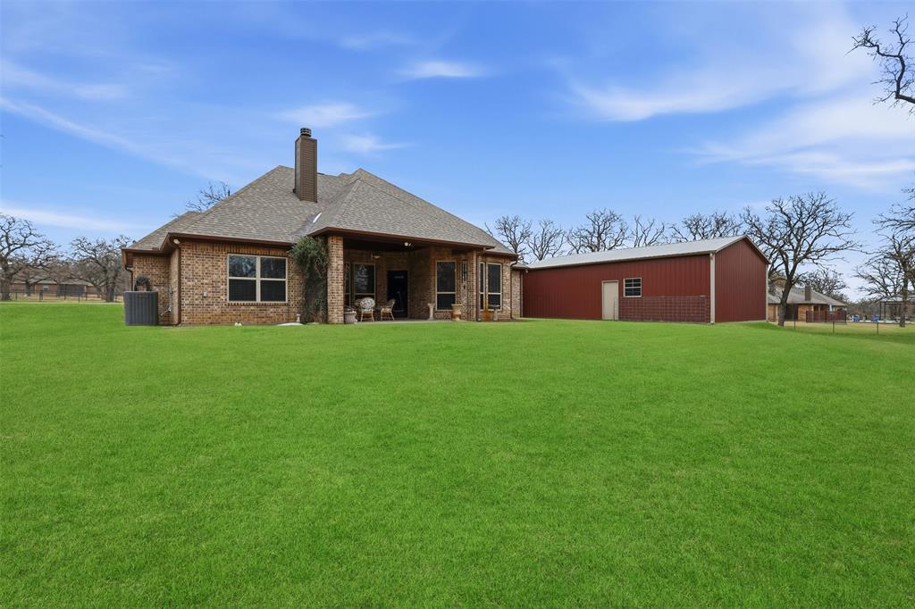 140 Flying Diamond Drive Springtown, TX 76082 - Photo 29 of 30 a front view of house with garden