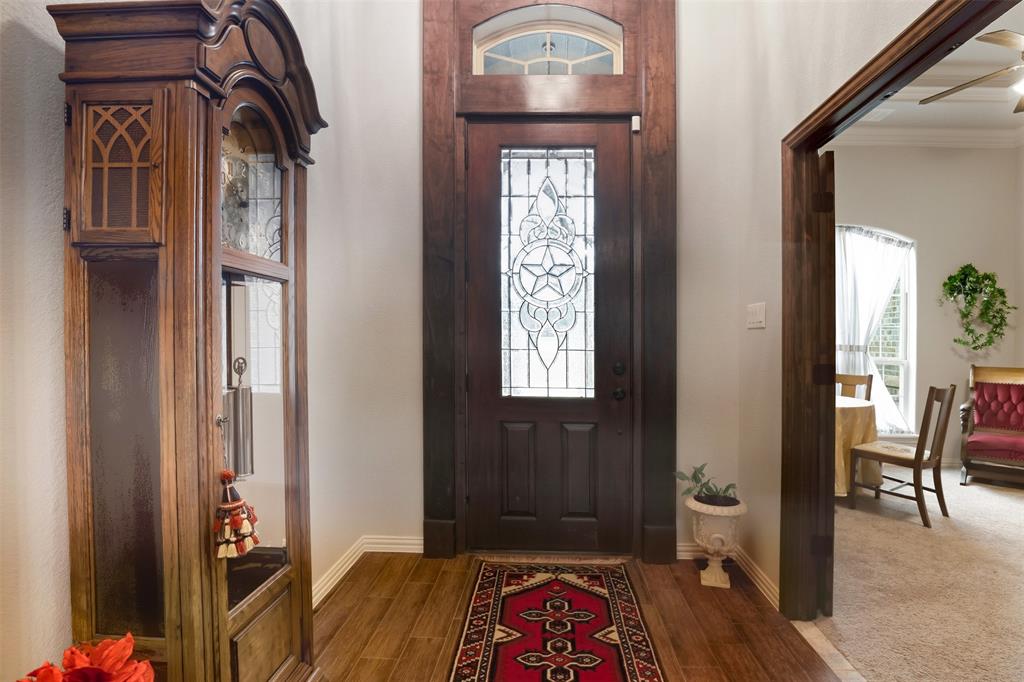 140 Flying Diamond Drive Springtown, TX 76082 - Photo 7 of 30 a view of an entryway with wooden floor