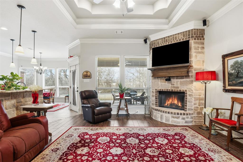 140 Flying Diamond Drive Springtown, TX 76082 - Photo 9 of 30 a living room with furniture fireplace and flat screen tv