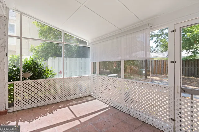 a view of a room with a large window