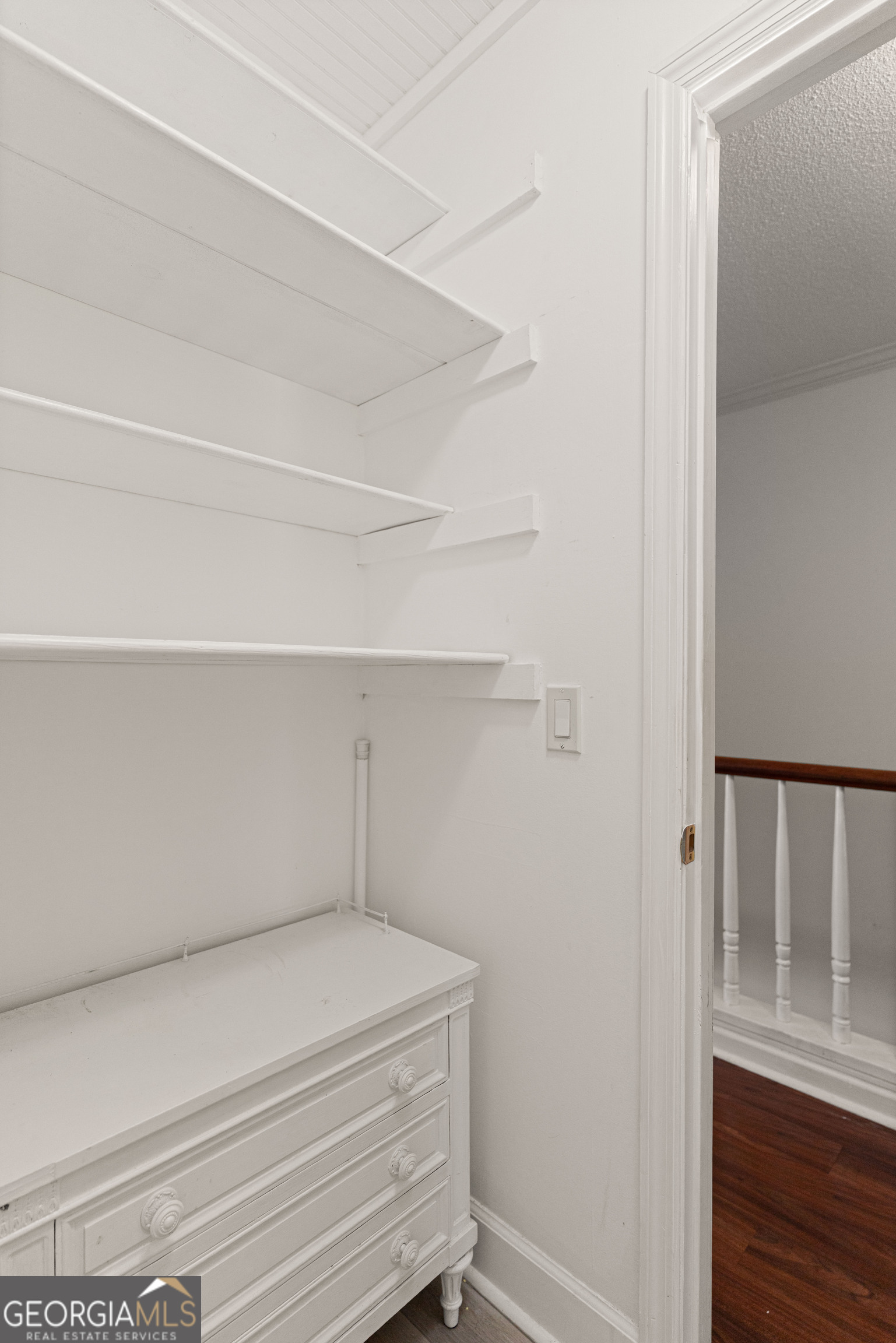 1000 Mallery St Extension, Unit B5 St. Simons, GA 31522 - Photo 20 of 24 a view of small space with racks on the wall