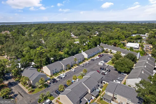 an aerial view of a house with a yard