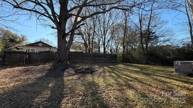 a view of a backyard of the house