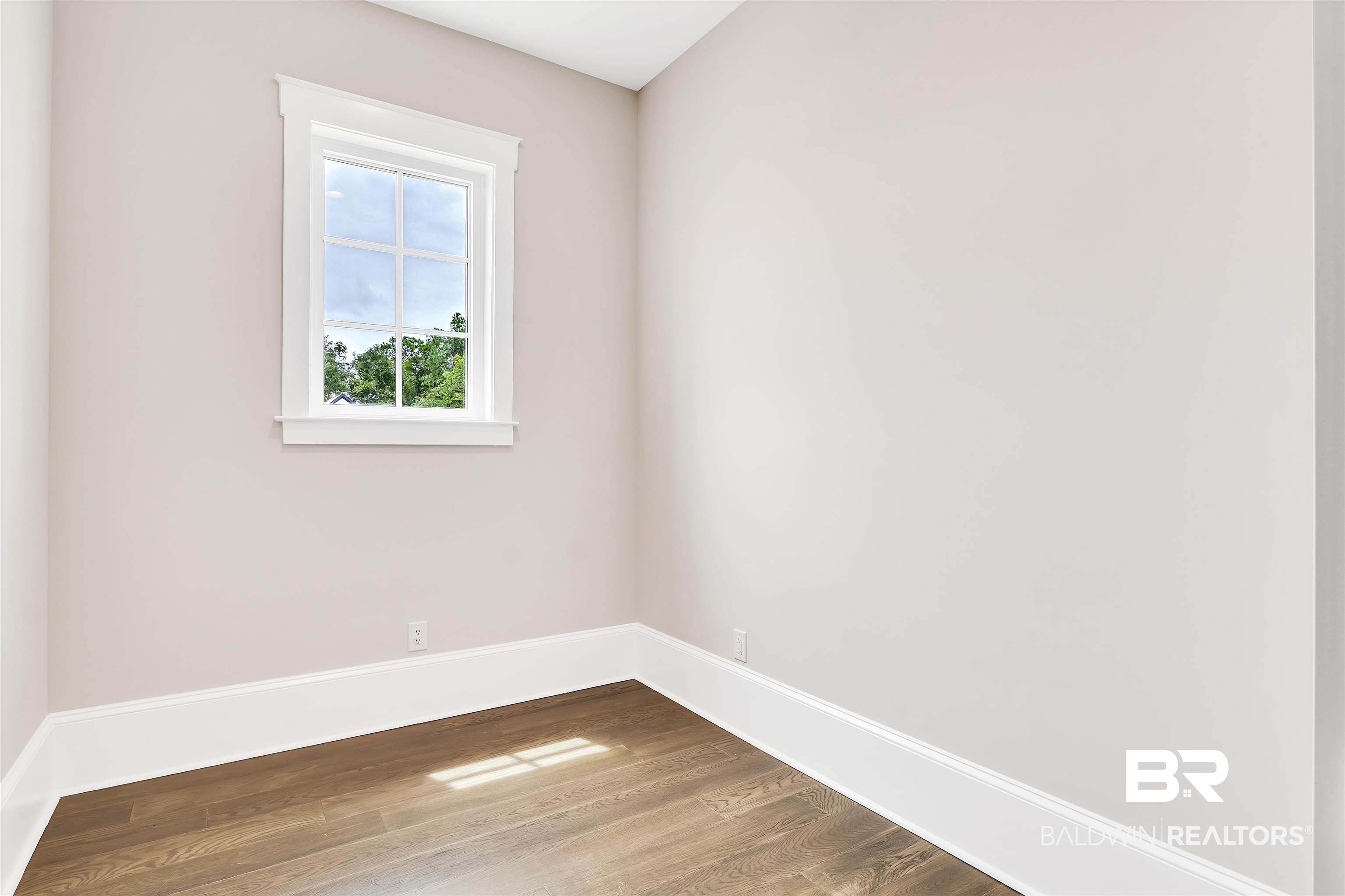 829 Inlet Circle Gulf Shores, AL 36542 - Photo 10 of 31 Empty room with wood-type flooring