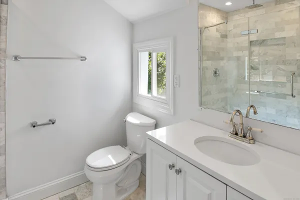 a bathroom with a sink toilet and vanity