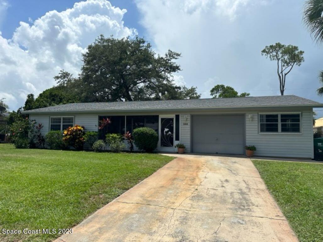 344 Columbus Street Sebastian, FL 32958 - Photo 1 of 35 a front view of a house with garden