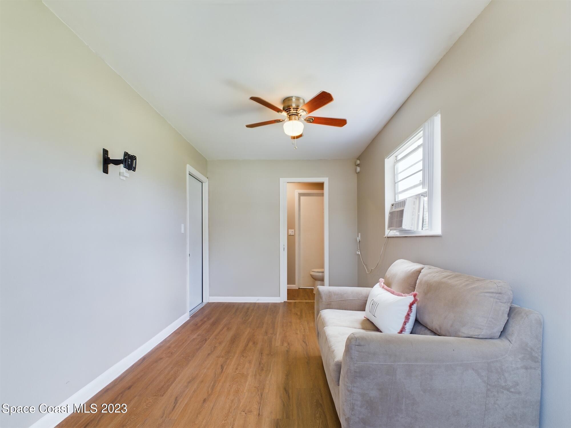 344 Columbus Street Sebastian, FL 32958 - Photo 11 of 35 a living room with furniture and a window