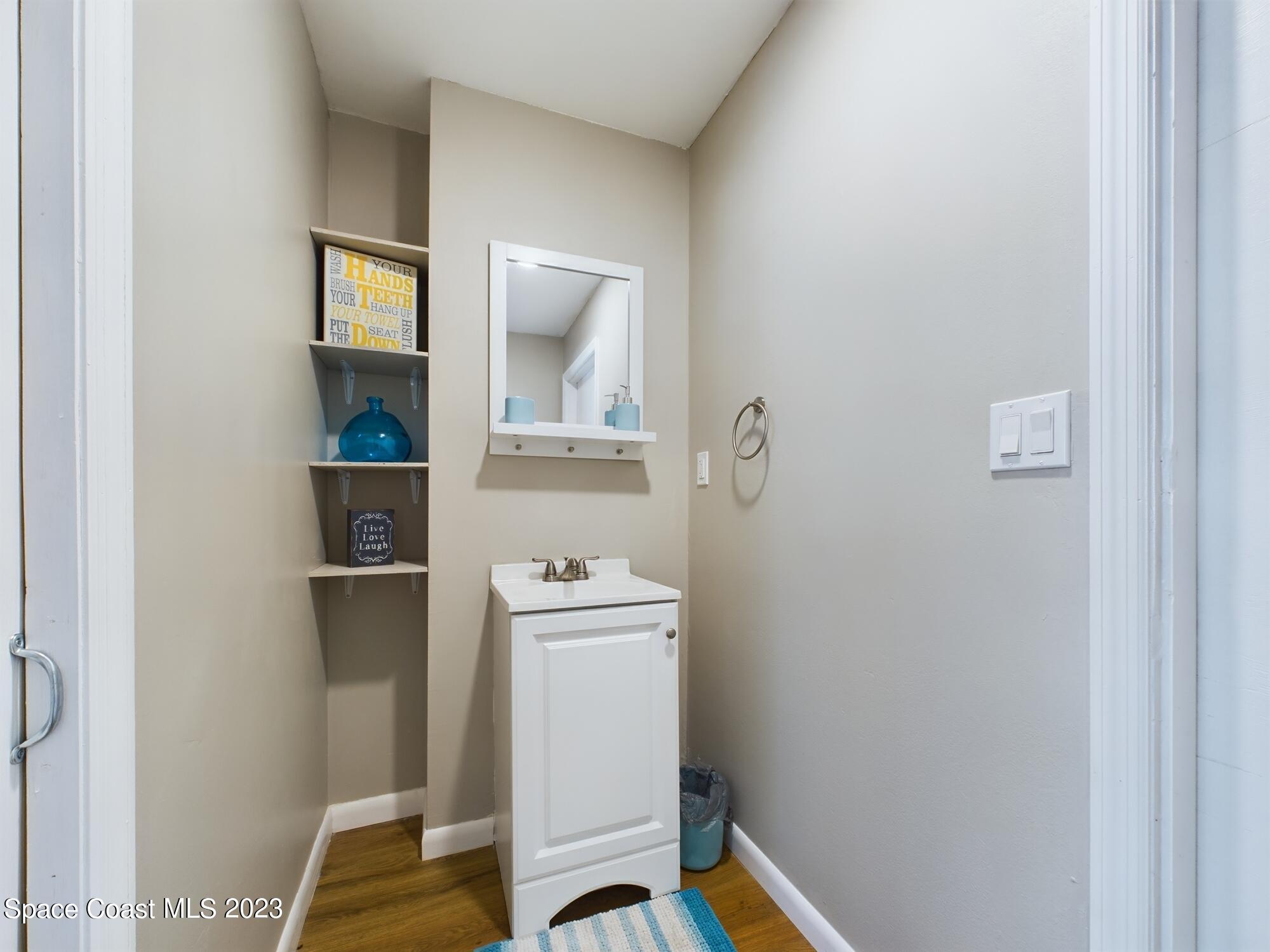 344 Columbus Street Sebastian, FL 32958 - Photo 12 of 35 a room that has a toilet and a mirror