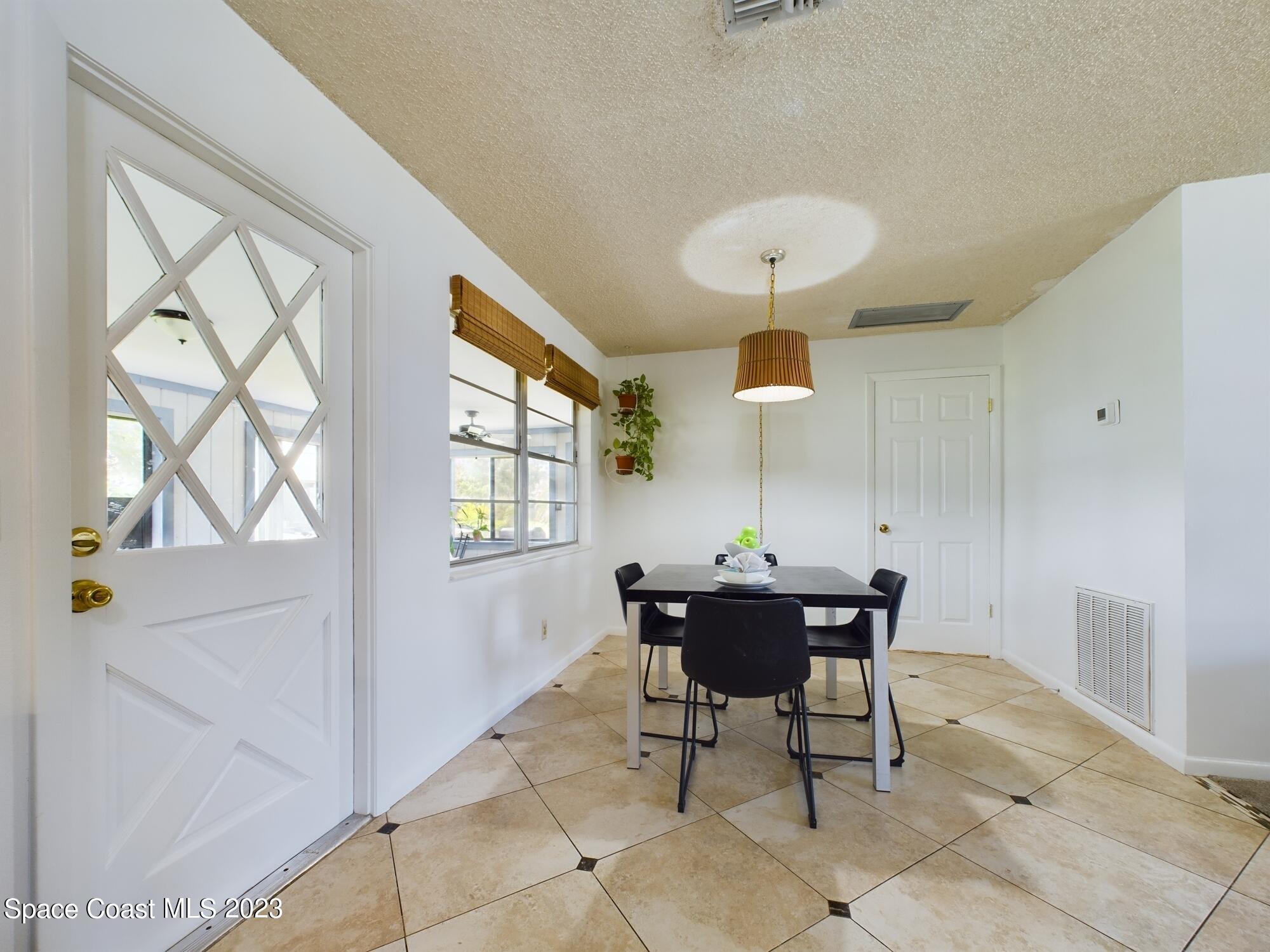 344 Columbus Street Sebastian, FL 32958 - Photo 17 of 35 a view of a dining room with furniture and window